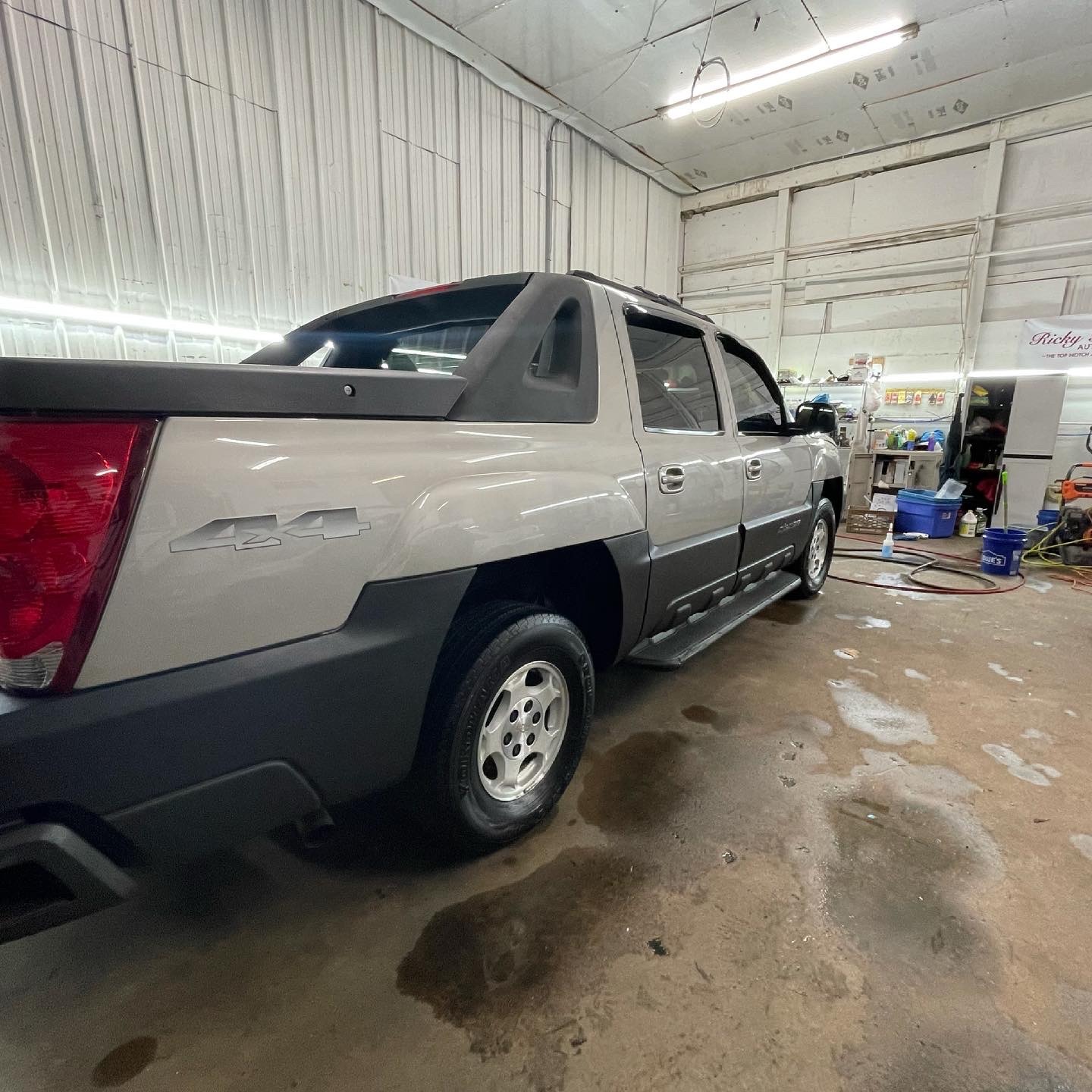 A close up of a pickup car inside the garage